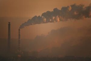 smoke billowing out of a pipe in the air