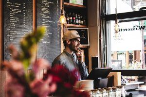 man behind the counter at a restaurant