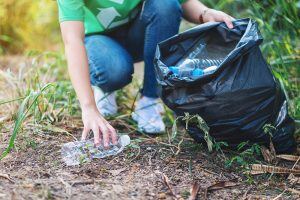 recyling bottles and putting in bag